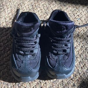 Black pair of all black air max sneakers l.